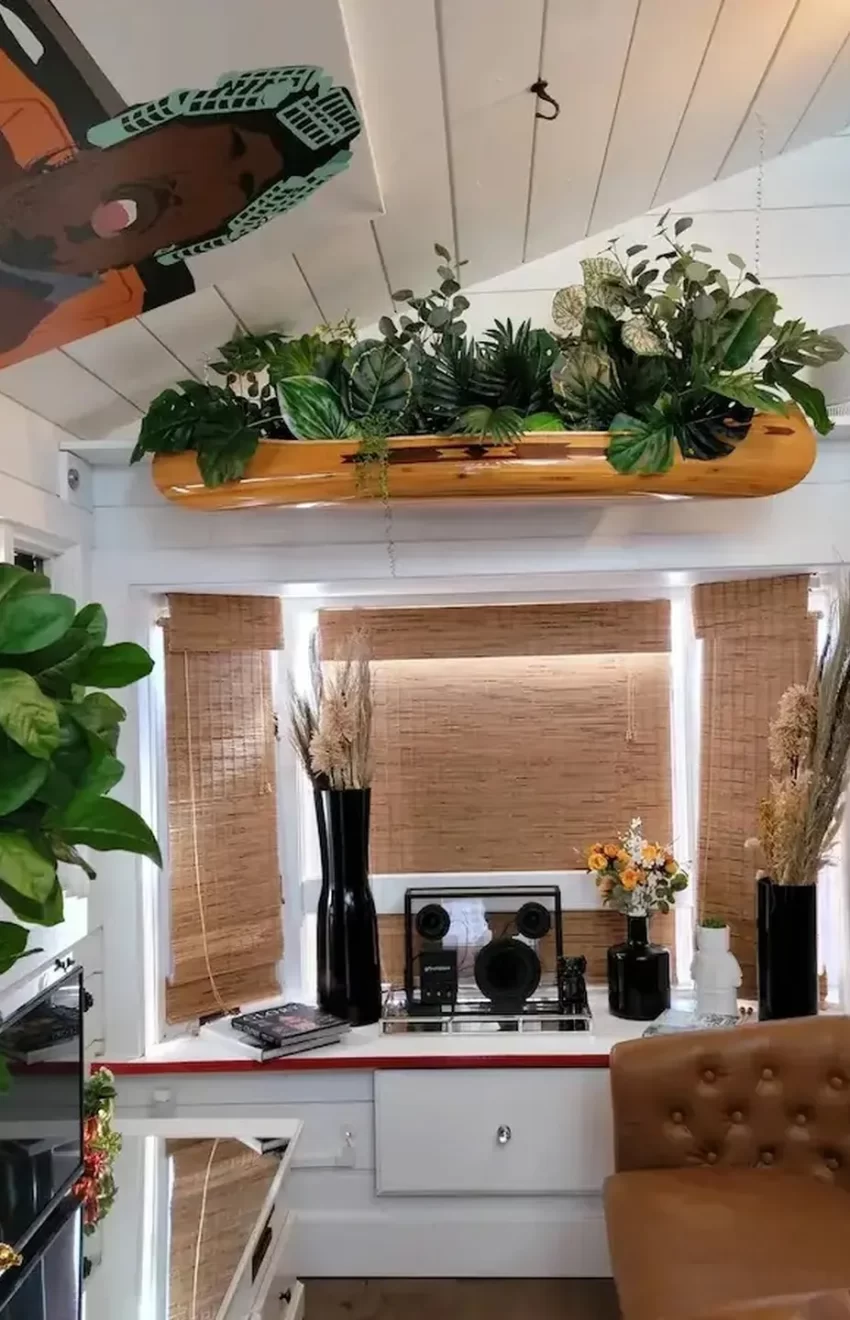 living-space-ansel-troys-airbnb-potted-plants-and-small-couch-front-tv-3023796 living-space-ansel-troys-airbnb-potted-plants-and-small-couch-front-tv-3023796